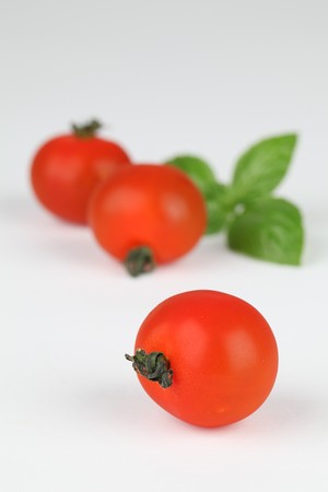Cherry tomatoes and basilの写真素材
