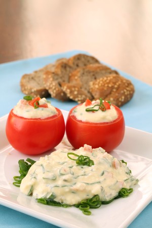 Egg spread with tomatoes and spring onionsの写真素材