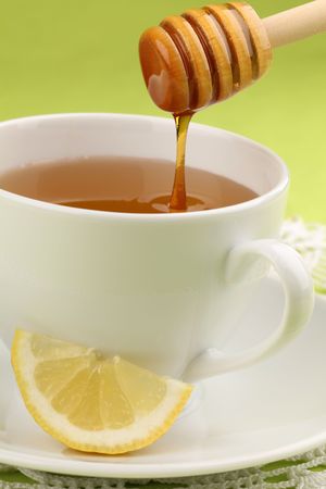 Healthy tea with honey and slice of lemonの写真素材