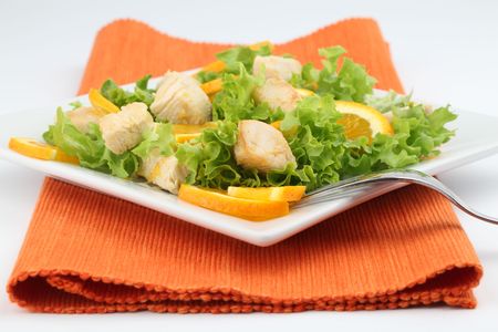 Chicken salad with fresh lettuce and orangesの写真素材