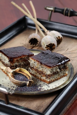 Poppy seed sponge cake with plum jamの写真素材