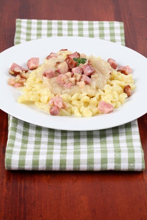 Slovak national food Halushky - potato dumplings with sauerkraut and meatの写真素材