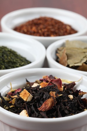 Tea collection - focus on black tea with flower petals and dried orange peelの写真素材