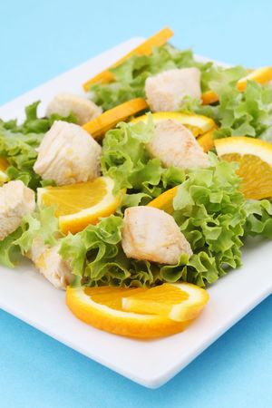 Chicken salad with fresh lettuce and orangesの写真素材