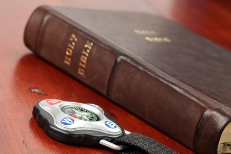 Compass and the Holy Bible in backgroundの写真素材
