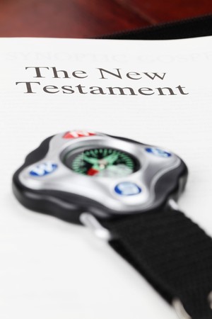 Compass and open Bible on the New Testament pageの写真素材