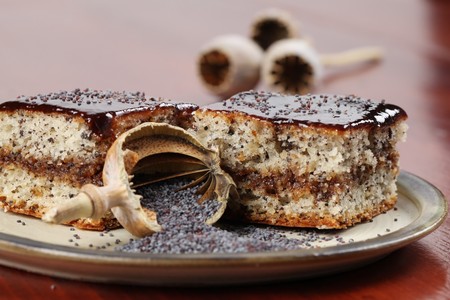 Poppy seed sponge cake with plum jamの写真素材