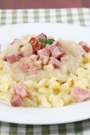 Slovak national food Halushky - potato dumplings with sauerkraut and meatの写真素材