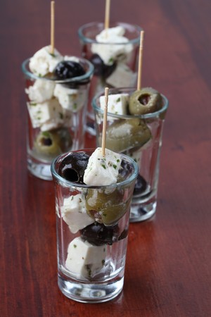 Greek appetizers with black and green olives and feta cheeseの写真素材