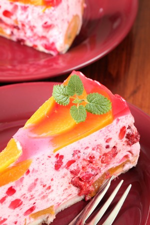 Red currant mousse with peaches and jellyの写真素材