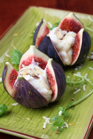 Figs with nut and honey cheese. Shallow dofの写真素材