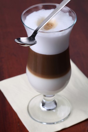 Freshly made cafe latte in a glassの写真素材