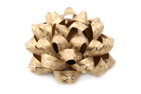 Close-up of gold bow isolated on white background. Shallow dofの写真素材