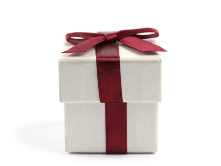 Little gift box with red bow isolated on white background