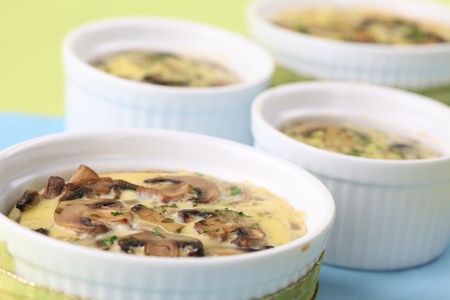 Mushroom gratin with eggs and cheese, garnished with parsley. Shallow dofの写真素材