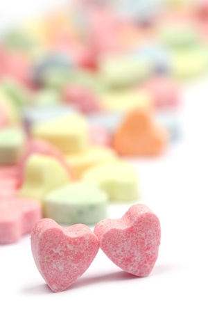 Little colorful candy hearts on white background. Shallow dofの写真素材