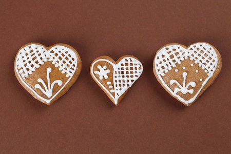 Gingerbread hearts on brown backgroundの写真素材