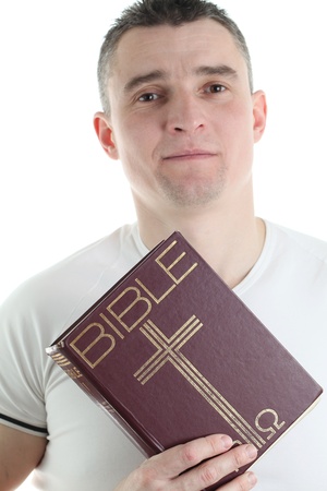Man holding the Holy Bible, isolated on white backgroundの写真素材