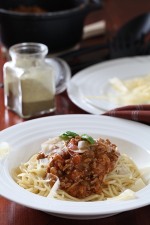 Spaghetti with bolognese sauce, cheese and basilの写真素材