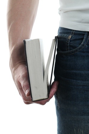 Man holding the Holy Bible, isolated on white backgroundの写真素材