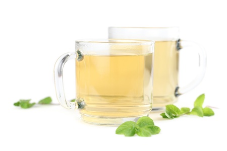 Mint leaf and freshly made mint tea in glass cups isolated on white backgroundの写真素材