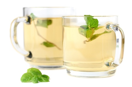 Mint leaf and freshly made mint tea in glass cups isolated on white backgroundの写真素材