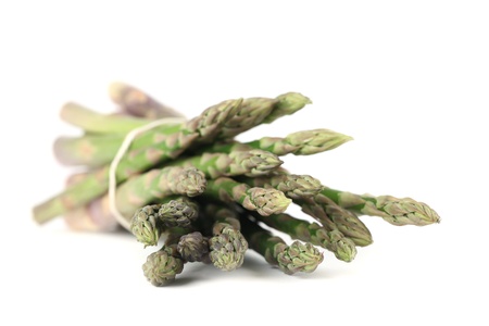 Bunch of fresh organic green asparagus on white backgroundの写真素材