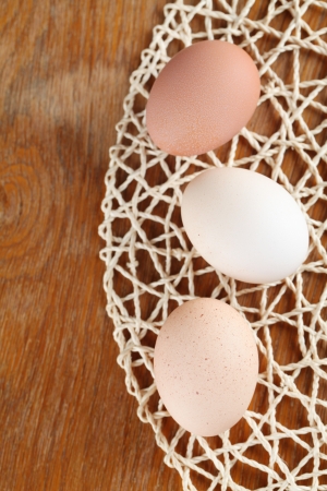 Border made of a straw mat and organic eggsの写真素材