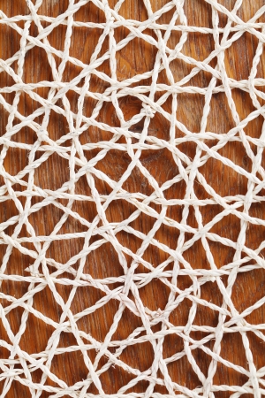 Abstractedly looking straw mat on wooden backgroundの写真素材