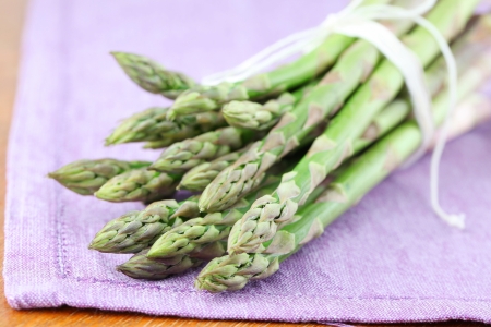 Green asparagus on purple napkin  Shallow dofの写真素材