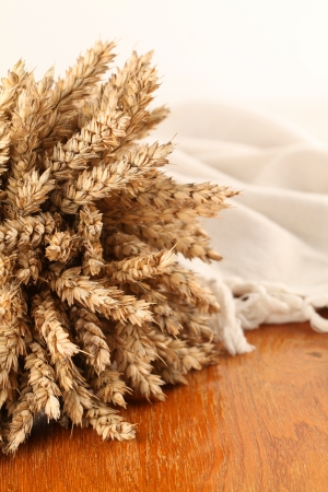 Bunch of wheat on a wooden table  Shallow dofの写真素材