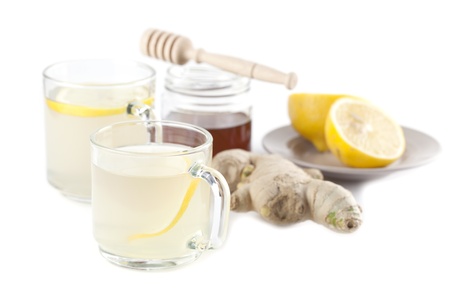 Ginger tea with honey and lemon isolated on white backgroundの写真素材