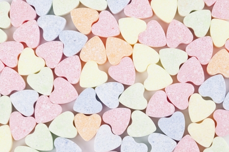 Background made of little colorful candy heartsの写真素材