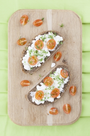 Healthy sandwiches with cottage cheese, cress and cherry tomatoesの写真素材