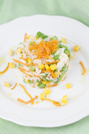 Vegetarian risotto with carrot, sweet corn and green beansの写真素材