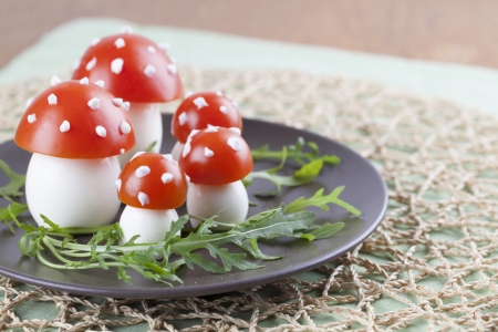 Fly agaric mushrooms made from tomatoes and chicken and quail eggsの写真素材