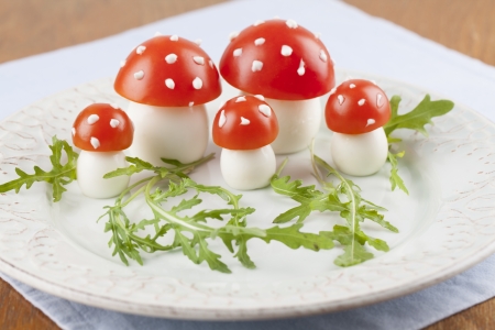 Fly agaric mushrooms made from tomatoes and chicken and quail eggsの写真素材