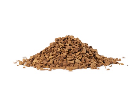 Instant coffee granules isolated on white backgroundの写真素材