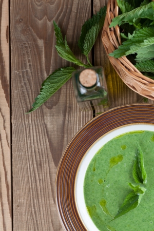 Nettle cream soup on wooden background  Shallow dofの写真素材