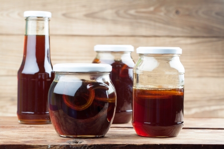 Jars with healthy, freshly made dandelion syrup â alternative medicine for cough, cold or fluの写真素材