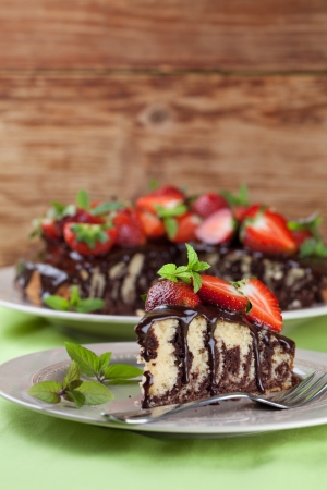 Marble cake with chocolate glaze and strawberries  Shallow dofの写真素材