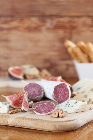 Meat with cheese, figs, nuts and grissiniの写真素材