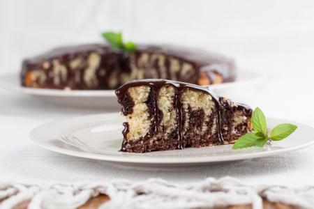 Zebra marble cake with chocolate glaze の写真素材