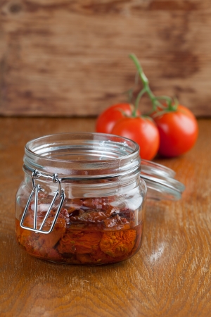 Sun dried tomatoes with olive oil in a jarの写真素材