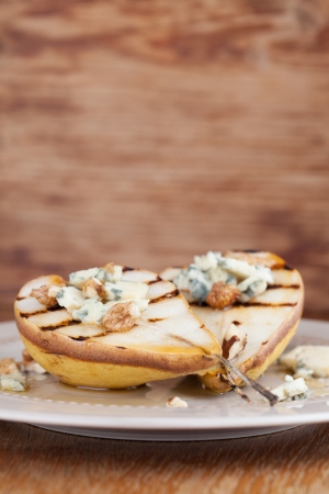 Grilled pear with gorgonzola, walnuts and honeyの写真素材