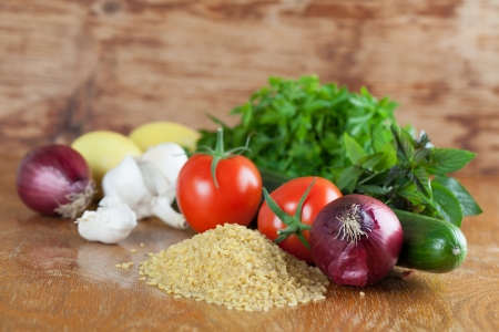 Fresh ingredients for tabbouleh on a wooden tableの写真素材