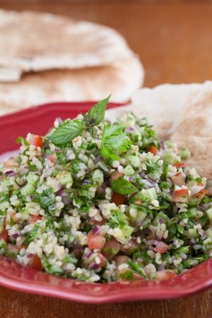 Gourmet Middle Eastern salad Tabbouleh with pita breadの写真素材