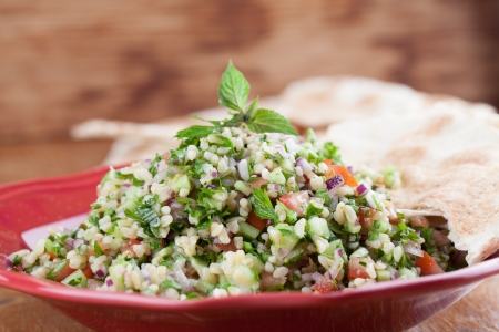 Gourmet Middle Eastern salad Tabbouleh with pita breadの写真素材