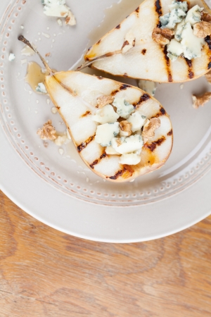 Grilled pear with gorgonzola, walnuts and honeyの写真素材