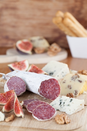 Meat with cheese, figs, nuts and grissiniの写真素材